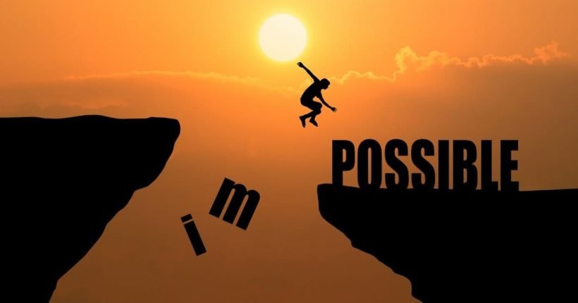man-jumping-impossible-possible-cliff-sunset-background-business-concept-idea_1323-265