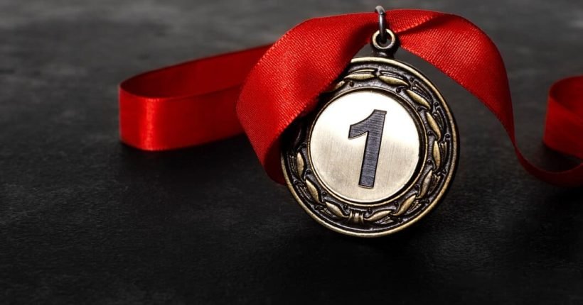 first-place-medal-with-red-ribbon_23-2148930702