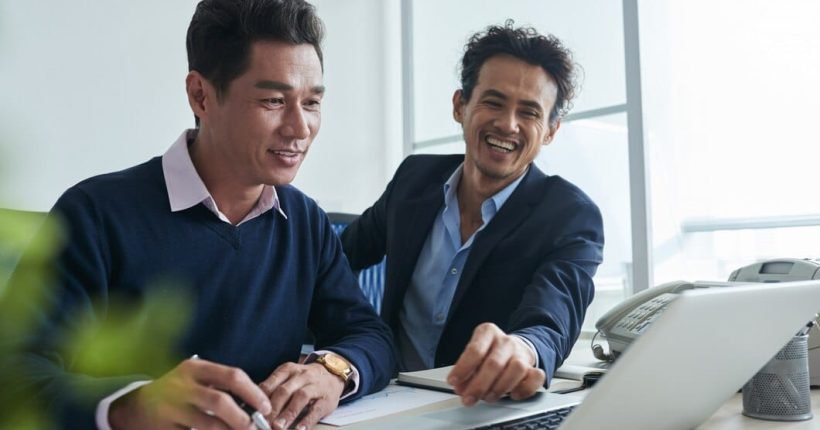 waist-up-shot-business-men-surfing-net-laptop-togther_1098-20465