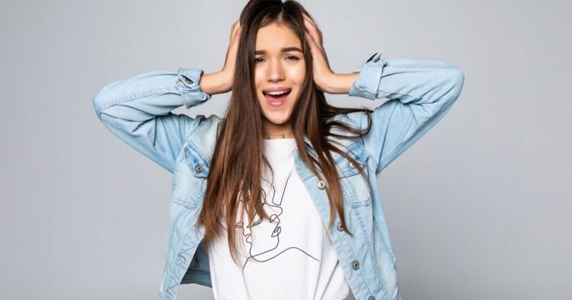 young-woman-covering-ears-shouting-isolated-white-wall_231208-1263